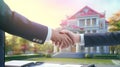 Two people shaking hands in front of a house Royalty Free Stock Photo