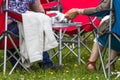 People in chairs sitting for picnic