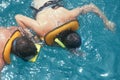 Two people snorkeling in water