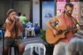 Two people, street artists, singers. Royalty Free Stock Photo