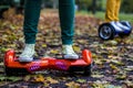 Two people are using hoverboards