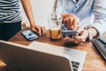 Two people using mobile while meeting in coffee shop for SMEs owner job Royalty Free Stock Photo