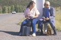 Two people waiting for the bus