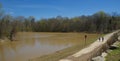 Two People walk a pathway along the Wolf River