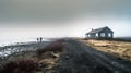 Two people walking along the coastline on a dark empty beach. Wooden house in a remote area near the ocean. Generative AI