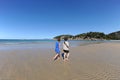 Two people walking on idyllic beach at Florence Bay, Magnetic Island, QLD, Australia