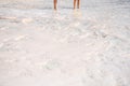 Two people walking over the Pamukkale white sedimentary rocks