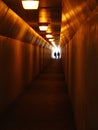 Two People Walking Through Sidewalk Tunnel Royalty Free Stock Photo