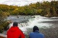 Two people watching five bears on Brooks falls, Alaska Royalty Free Stock Photo