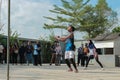 two people who are taking part in a badminton game