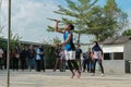 two people who are taking part in a badminton game