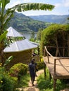 Two people beside a wooden hut on an island on Lake Bunyonyi Royalty Free Stock Photo