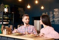 Two people young man and woman in coffee shop enjoying time spending with each other. Romantic acquaintance concept. Royalty Free Stock Photo