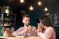 Two people young man and woman in coffee shop enjoying time spending with each other. Romantic acquaintance concept. Royalty Free Stock Photo