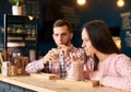 Two people young man and woman in coffee shop enjoying time spending with each other. Romantic acquaintance concept. Royalty Free Stock Photo