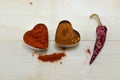 Two pepper hearts and a dried paprika Royalty Free Stock Photo