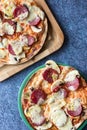 Two pepperoni pizza with mozzarella cheese, white mushroom and sriracha