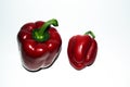 Two peppers. Large and small bell peppers. On white background Royalty Free Stock Photo