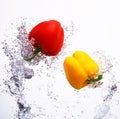 Two peppers splashing Royalty Free Stock Photo