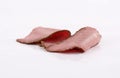 Two perfectly arranged slices of roast beef on white background