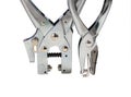 Two perforation device on a white background, macro Royalty Free Stock Photo