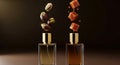 Two perfume bottles with floating ingredients against a dark background Royalty Free Stock Photo
