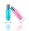 Two perfume bottles with reflections isolated on white Royalty Free Stock Photo