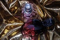 Two perfumes over gold Royalty Free Stock Photo