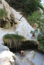 Two person bathing in the natural hot springs pool