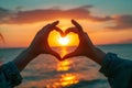 two person hand making heart shape with hands with sunset background Royalty Free Stock Photo