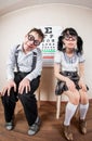 Two person wearing spectacles in an office at the doctor Royalty Free Stock Photo