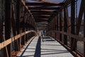 Two persons raiding their bikes in a bridge