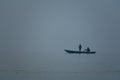 Two persons sailing the boat in the middle of Ganges River Royalty Free Stock Photo