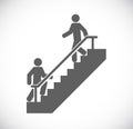 Two persons walk stairs