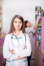 Two pharmacist at the desk Royalty Free Stock Photo