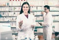 Two pharmacists in modern pharmacy