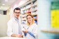 Two pharmacists working in a drugstore.