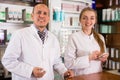 Two pharmacists working in farmacy Royalty Free Stock Photo