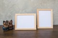 Two photo Frame and toy cat on a wooden Royalty Free Stock Photo