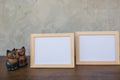 Two photo Frame and toy cat on a wooden Royalty Free Stock Photo