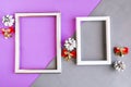 Two photo frames and Christmas decorations on color background, copy space for the text. Royalty Free Stock Photo