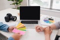 Two photographers with camera and laptop computer working in office Royalty Free Stock Photo