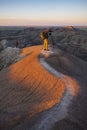 Two photographers photograph White River Valley Overlook at Badlands National Park during a sunrise
