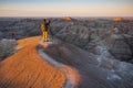 Two photographers photograph White River Valley Overlook at Badlands National Park during a sunrise