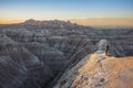 Two photographers photograph White River Valley Overlook at Badlands National Park during a sunrise