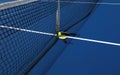 Two pickleball paddles with a whiffle ball at the net Royalty Free Stock Photo