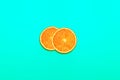 Two piece of orange slice in pastel color background.fruit and summer concept idea.