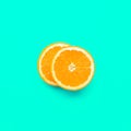 Two piece of orange slice in pastel color background.fruit Royalty Free Stock Photo