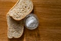 Two pieces of black bran fresh bread with white salt in a salt shaker Royalty Free Stock Photo