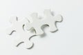 Two pieces of white jigsaw puzzle Royalty Free Stock Photo